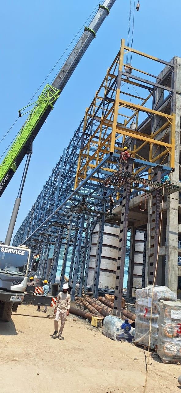 On-site heavy structural work with crane support